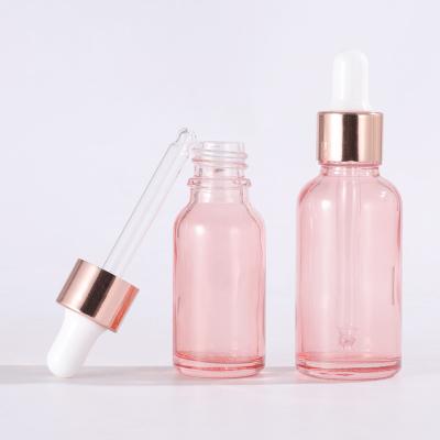 China 5ml 10ml 15ml 20ml Cosmetic Glass Oil Bottle 30ml 50ml Pink Essential Glass Dropper Bottle With Rose Gold Cap For Aroma Perfume Oil for sale