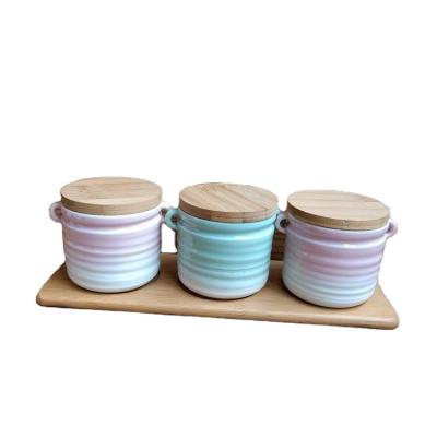 China Sustainable Colorful Ceramic Spice Tea Sugar Jar Set With Bamboo Lid And Bamboo Tray for sale