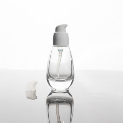 China Custom High Quality Oval Transparent Cosmetic Bottles 30ML Lotion Glass Bottle for sale