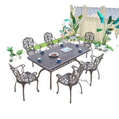 China Modern Luxury Metal Patio Outdoor Cast Iron Chair Aluminum Dining Table All Weather Garden Dining Tea Table Set for sale