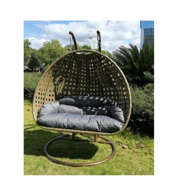 China Modern Indoor and Outdoor Rattan Garden Patio Egg Chair Hammock Hanging Swing Basket with Steel Frame and Soft Cushions for sale