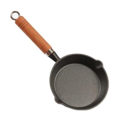 China Hot Selling Creative Wooden Small Pan Viable Non Handle Stick Cast Iron Mini Frying Pan for sale