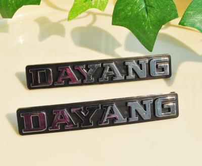 China Interior Stickers Embossed Letter On Black Plate Chrome Car Badge for sale