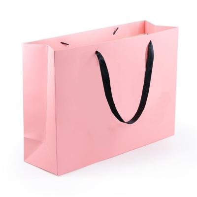 China Manufacturers Custom Recyclable Packaging Bag Retail Paper Shopping Bags For Clothes for sale