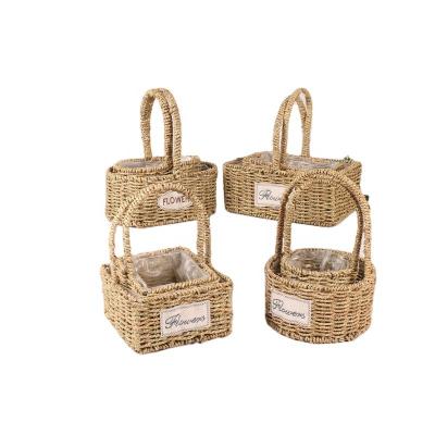 China Straw Flower Basket Flower Style Handwoven Stocked Basket Flower Pastoral Handmade Storage Basket Pot With Handle for sale