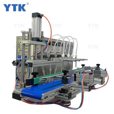 China YTK-MPF4 Full Automatic Desktop Food CNC Oil Liquid Filling Machine With Conveyor Beverage Milk Perfume Filling Machine Water Filler for sale