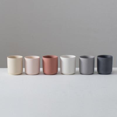 China Cheap classic unique matte ceramic design 12oz 10oz candle container jar holder home decoration empty vessels with lid for sale