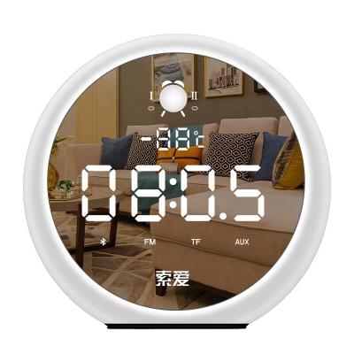 China Wireless Charger for Bedside Creative Blue Wireless Alarm Clock Speaker Tooth Mobile Phone Mirror Subwoofer Portable Speaker for sale