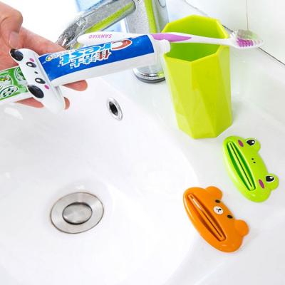 China 2022 hot sale most popular viable non-toxic removable device toothbrush lazy holder with toothpaste squeezer for sale