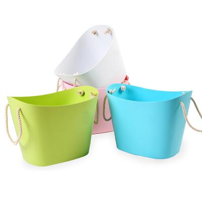 China OEM Modern Laundry Basket Sundries Bathroom Toiletry Color Candy Storage Plastic Bucket With Rope Handle for sale