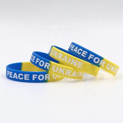 China Ukraine Promotional Wristband Ink Filled Debossed Logo RTS Silicone Wristbands Elastic Band for sale