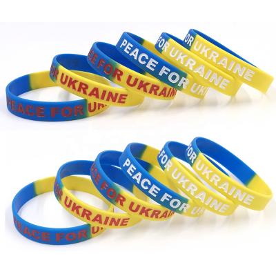 China All RTS 12mm Debossed With Color Segmented Peace For Ukraine Rubber Strap for sale