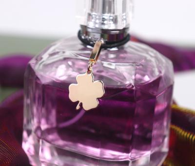 China 2021 new style high end four leaf clover waterproof perfume tags plating process metal tags custom logo tags for sale