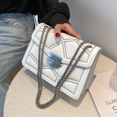 China 2021 simple brand designer fashion Rivet Chain Shoulder women's PU women's handbags leather ladies wave purse for sale