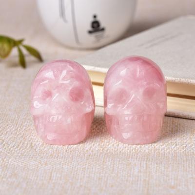 China Natural China 2Inch Crystal Hand Made Rose Quartz Head Skulls Figurines Ornaments For Home Decoration for sale