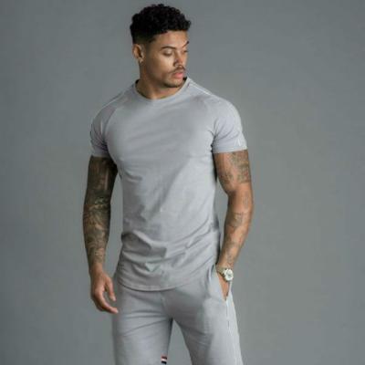 China Hot Selling QUICK DRY Sports and Leisure Boys Sleeve T-shirt Shorts Solid Color Men's Striped Suit for sale