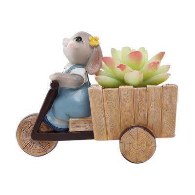 China Eco-friendly Resin Flower Pots Rabbit Riding Bike Creative Animal Flower Pots And Planters for sale