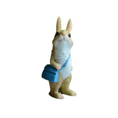 China Little World Cute Funny Rabbit With Bag Back To School The Bunny Den Resin Rabbits Garden Animal Statues Sculpture for sale