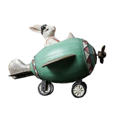 China EU& Wholesale Customized America Rabbit Polyresin Plane Crafts Decoration Rabbit Statues Resin Craft For Garden for sale