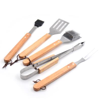 China Easily Cleaned Cheap Handle 2021 Wooden 5 Piece Stainless Steel Barbecue Grill Tool Kit for sale