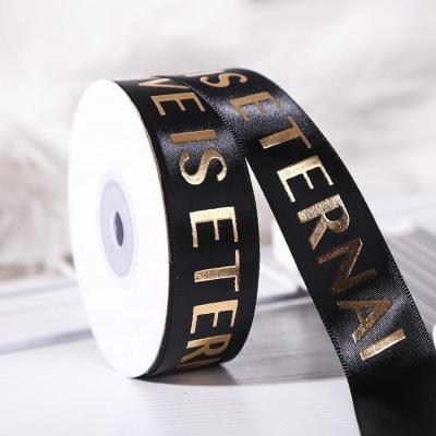 China Custom gold foil printed logo satin embossed ribbon workable for chocolate box packaging for sale