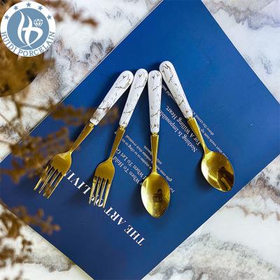 China Viable Creative Printed Ceramic Stainless Steel Handle Fork Spoon Set Porcelain Handle Flatware Set for sale