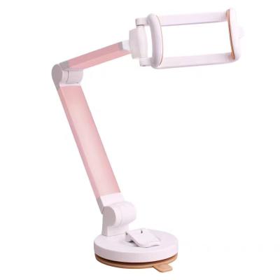 China Mini Lazy Phone Holder Sticky Suction Cup Foldable Desktop Stand Holder for sale