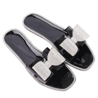 China Fashion Trend Hot Sale PVC Freeze Black Flat Shoes Sandals Slides For Women Girl Ladies for sale