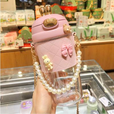 China Custom Strap Straw Portable Kid Water Bottle Logo With Leather Case And Cute Viable Cartoon Reusable Plastic Water Bottles 580ml for sale