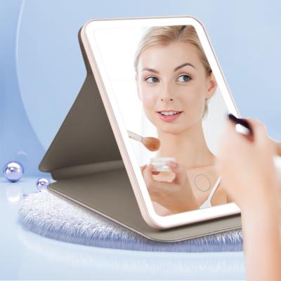 China Lighted 3 Color Lighted Makeup Mirror Adjustable Touch Screen Cosmetic Mirror Folding Portable Led Makeup Mirror With Led Light for sale