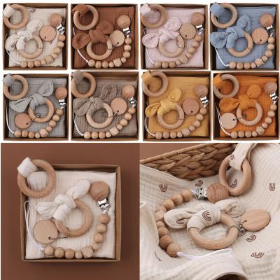 China PVC Free 1 Set Bunny Ear Wooden Ring Baby Teether Bibs Saliva Towel Newborn Pacifier Clips Chain Molar Baby Gym Wristband Teethers Set for sale