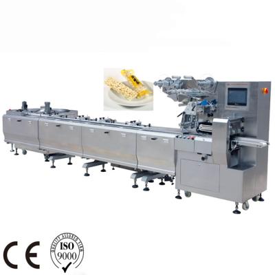 China New Food Flow Packing Machine Disc Bar Nougat Packing Machine Feeding Wrapping Machine for sale