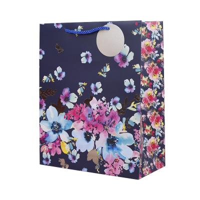 China Recyclable New arrival wholesale price floral printed paper bags with your own logo clothing for clothes for sale