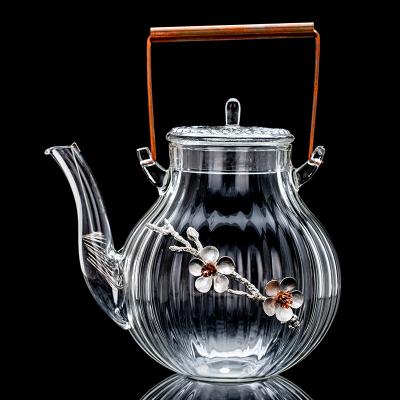 China Sustainable New Design Heat Resistant Flower Series Embossed Glass Tea Sets Teapot With Handle for sale