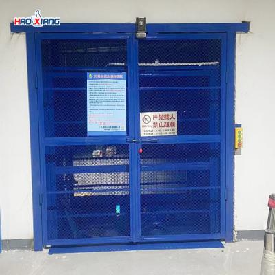 China 500kg-20000kg Industrial Elevators And Lifts Blue Freight Elevator Platform for sale