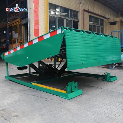 China Cargo Warehouse Dock Leveler Push Button Truck Level Dock Green for sale