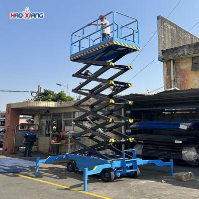 China Indoor Outdoor Mini Mobile Scissor Lift 400kg-3100kg Wheeled Scissor Lift for sale