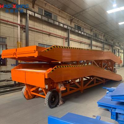 China Hand-Hydraulic Mobile Dock Leveler - Manual Adjustable Loading Ramp for Trucks & Warehouses for sale