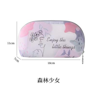 China Fashion High Quality Women's Hot Sale TPU Wash Bag Cartoon Lady Make Up Travel Cosmetic Bag for sale