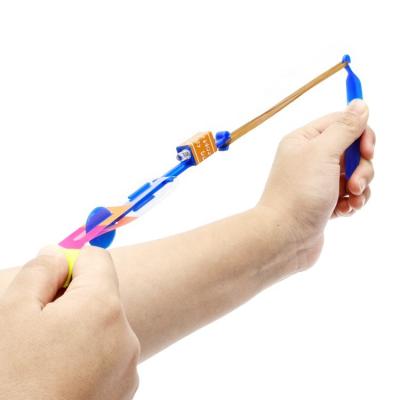 China Cool Electronic Toy It At Night Outdoor Parent-child Games Led Arrow Flying Umbrella Toy Slingshot Flying Toys for sale