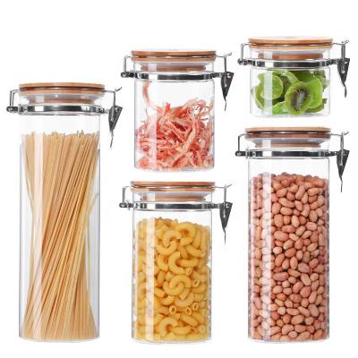 China Stocked Clear Borosilicate Glass Food Storage Jar Canister Container With Flange Airtight Locking Bamboo Lid for sale