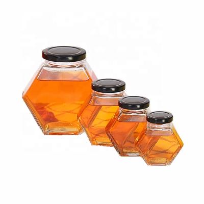 China Viable Cheap Glasses Wholesale Empty Hexagonal 280ml Storage Glass Honey Jar for sale