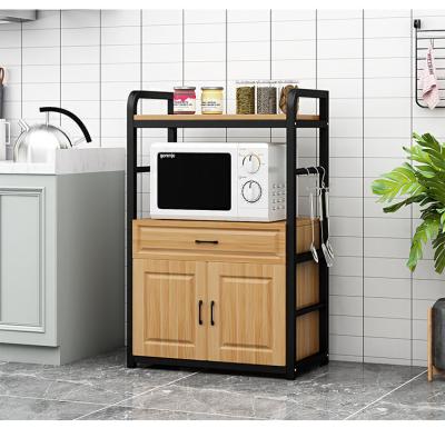 China Sustainable Kitchen Shelves Floor-to-Floor Multilayer Corner Storage Rack Microwave Oven Storage Cabinet for sale