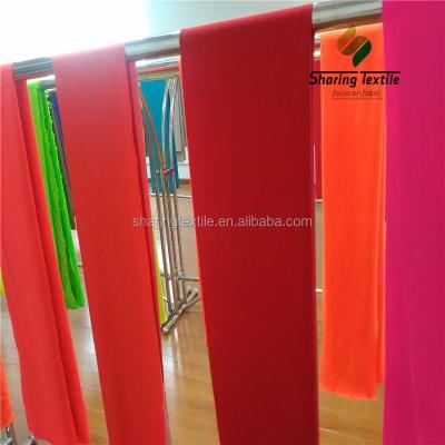 China Fluorescent wholesale fluorine orange polyester fabric/polyester fluorine color fabric/fluorine color orange fabric for sale