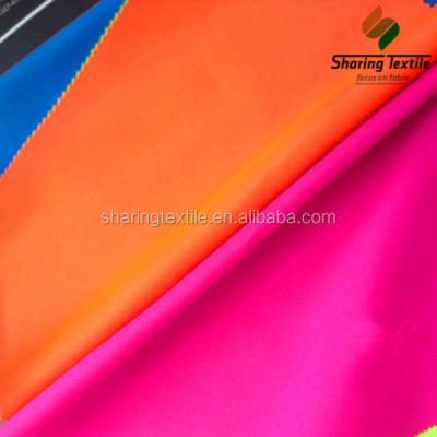 China 100% fluorescent polyester reflective fabric for safety garment for sale