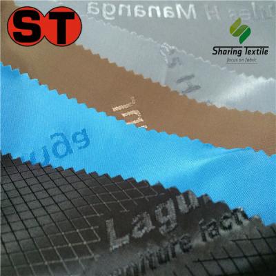 China Fluorescent coating fabric with logo /brand fabric brand taffeta/lining lining fabric embossed logo for sale