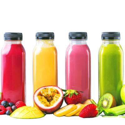 China Eco - Friendly Disposable Pet Beverage Bottle Empty Plastic Fruit Juice Bottle With Lid for sale