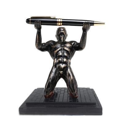 China Japan Kneeling Strongman Pen Holder Antique Color With Black Base Antique Silver for sale