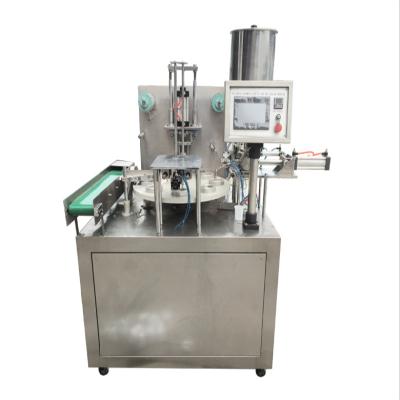 China Small Rotary Type Water Cup Food Juice / Liquid Milk Cup Filling Sealing Machine for sale