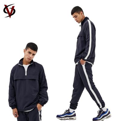 China Streetwear Style Mens Custom Design Polyester Nylon Sports Tracksuits for sale